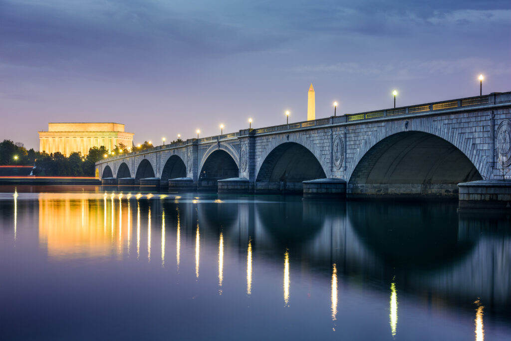 Washington DC, USA skyline on the Potomac River with Lincoln Memorial, Washington Monument, and Arlington Memorial Bridge.